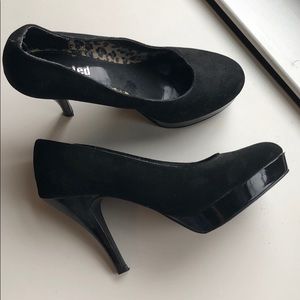 Black suede pumps with patent leather detail